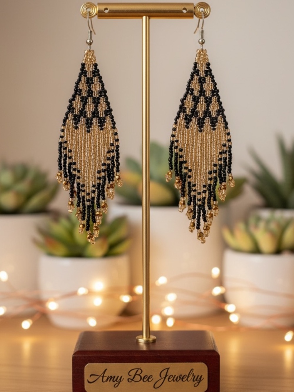Shimmering Gold and Black Geo patterned beaded tassel earrings. New.